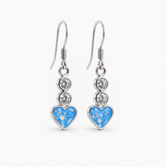 Twin Crystal Heart Drop Ashes Earrings — Sky Blue, visible ashes