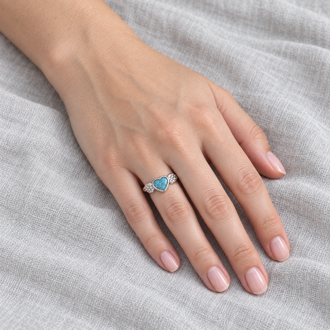 winged heart ashes ring in Sky Blue, shown at natural scale