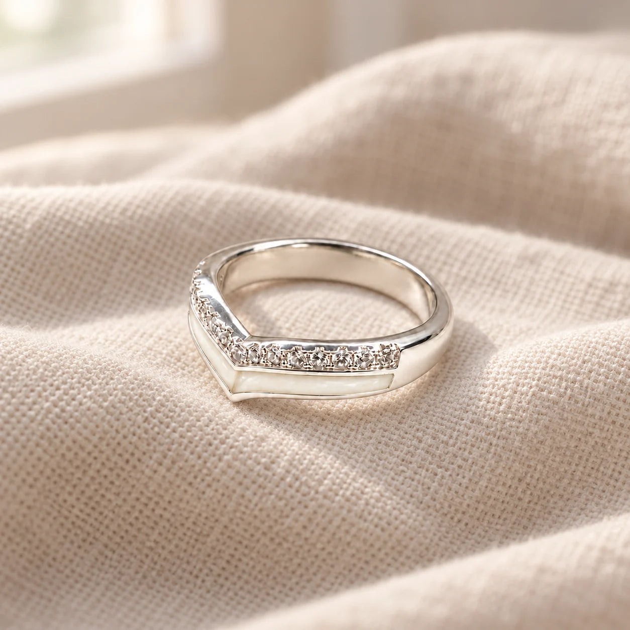 Wishbone Breast Milk Ring on pale linen — illustrative preview